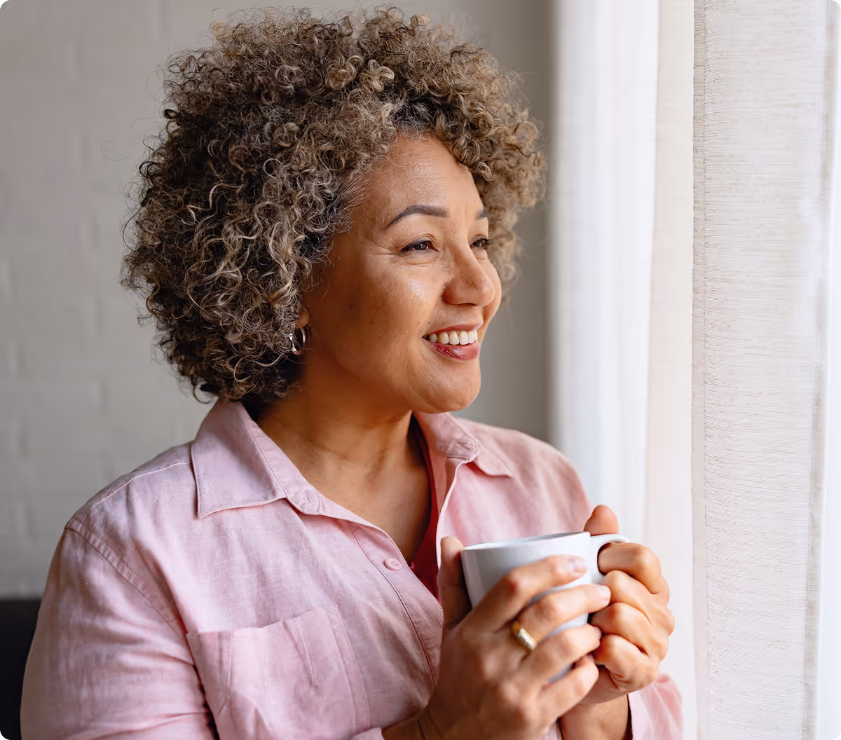 Woman enjoying a cup of Lulutox Tea